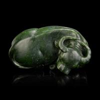 A Chinese Spinach Jade Buffalo, Qing Dynasty 清 青玉臥牛
