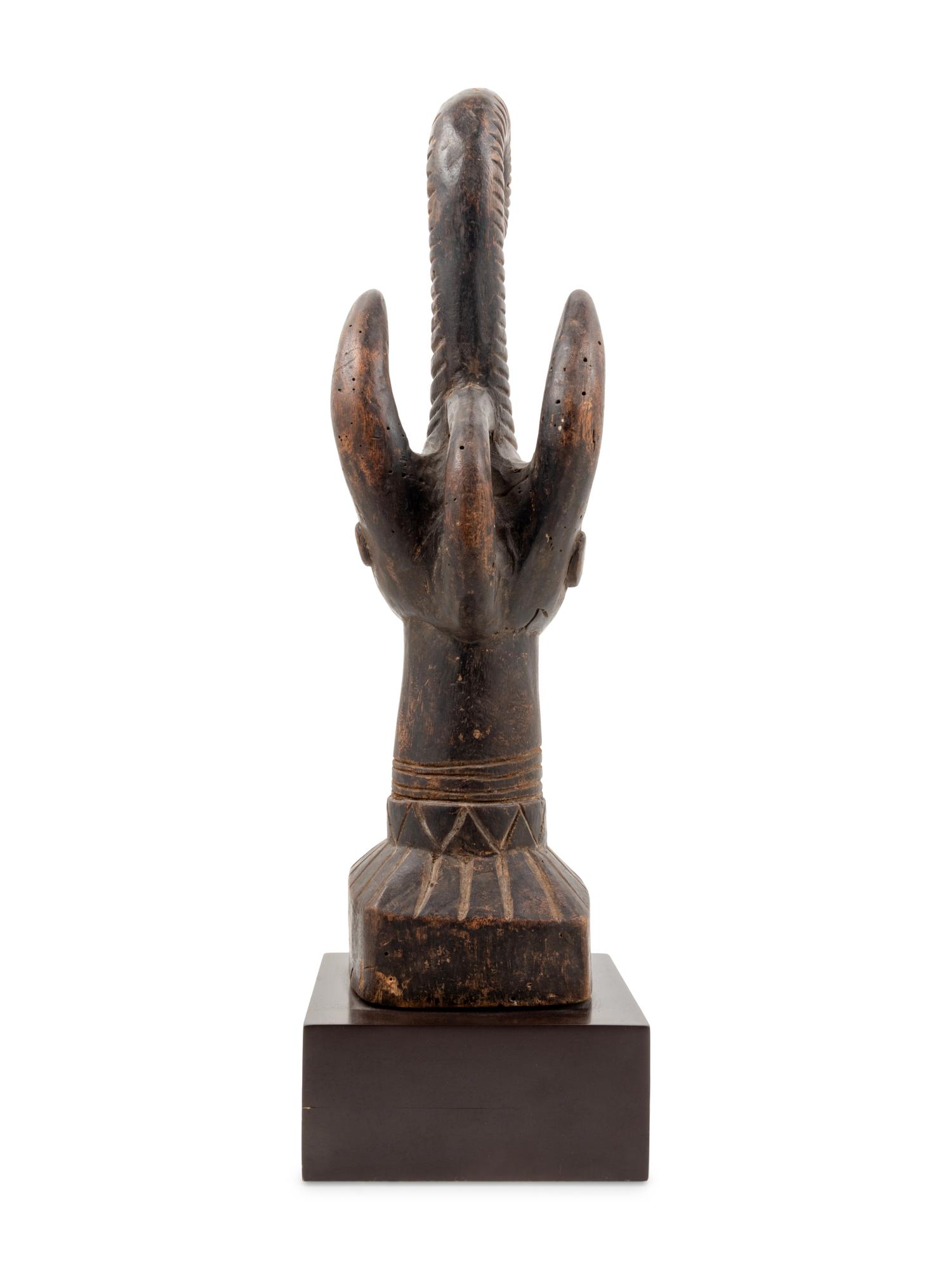 An Igbo Style Carved Wood Sculpture