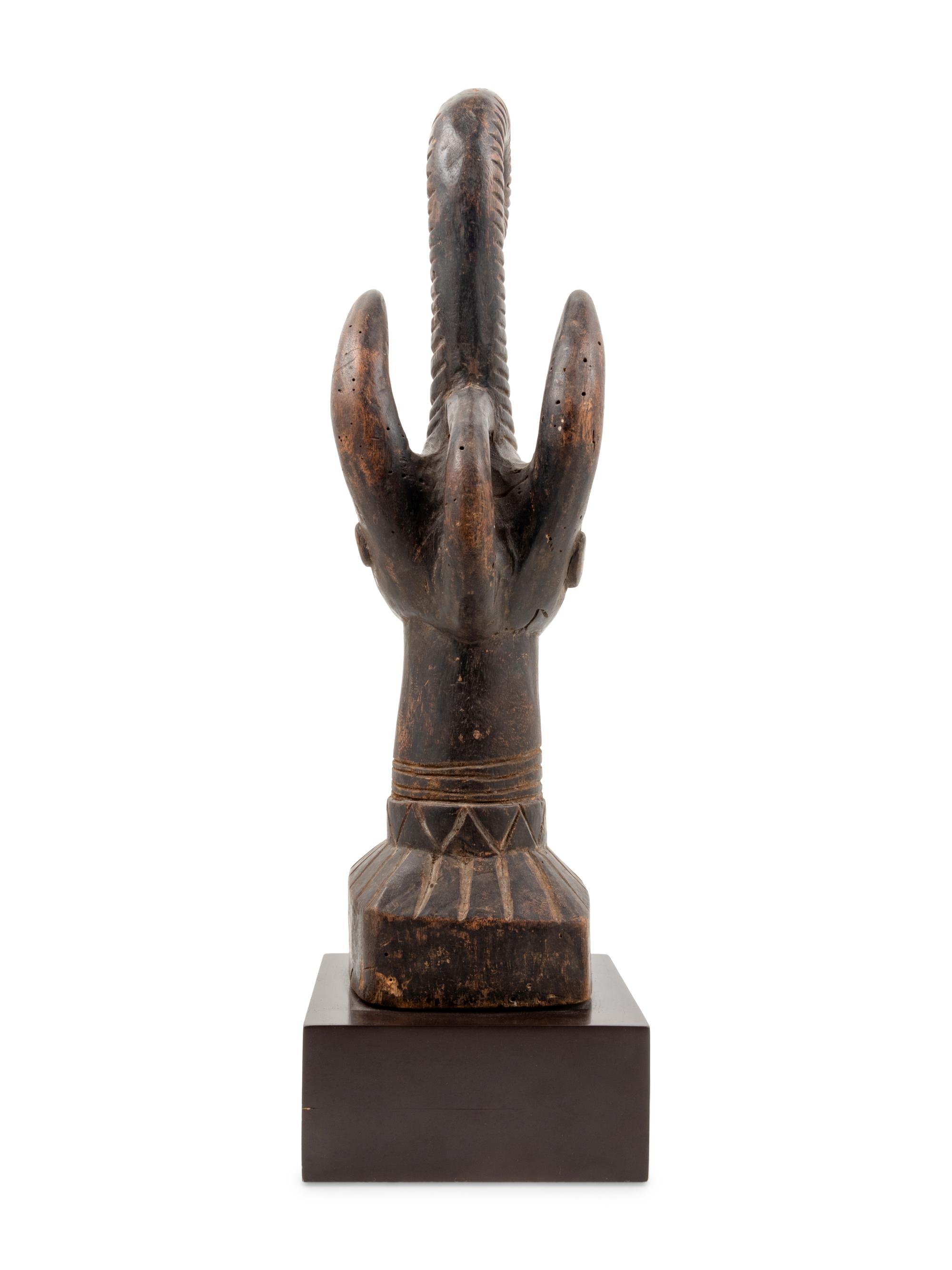 An Igbo Style Carved Wood Sculpture