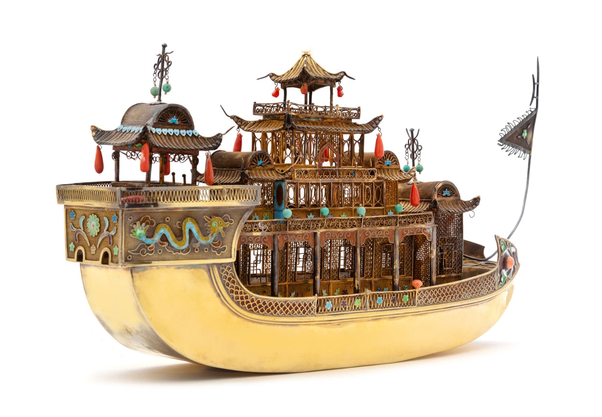 A Chinese Export Silver-Gilt and Enameled Model of a Hua Fang Ship, 20th Century, the three-tiered ship with coral and turquoise embell