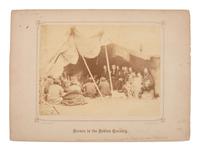 GARDNER, Alexander (1821-1882), photographer. Albumen photograph of council meeting at Fort Laramie, showing multiple commissioners with Arapaho and Cheyenne leaders. May 1868.