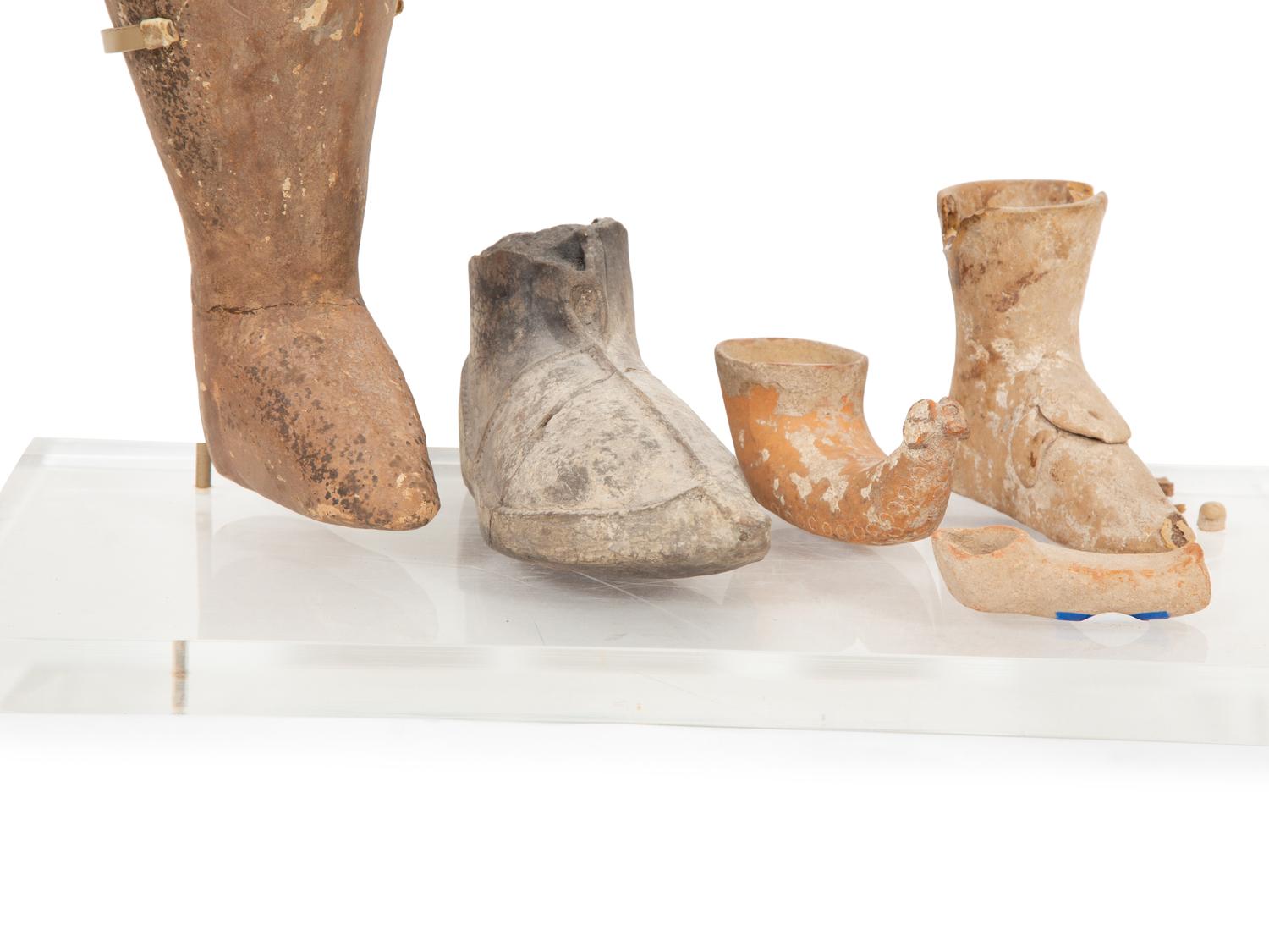 A Group of Earthenware Shoe-Form Drinking Vessels
