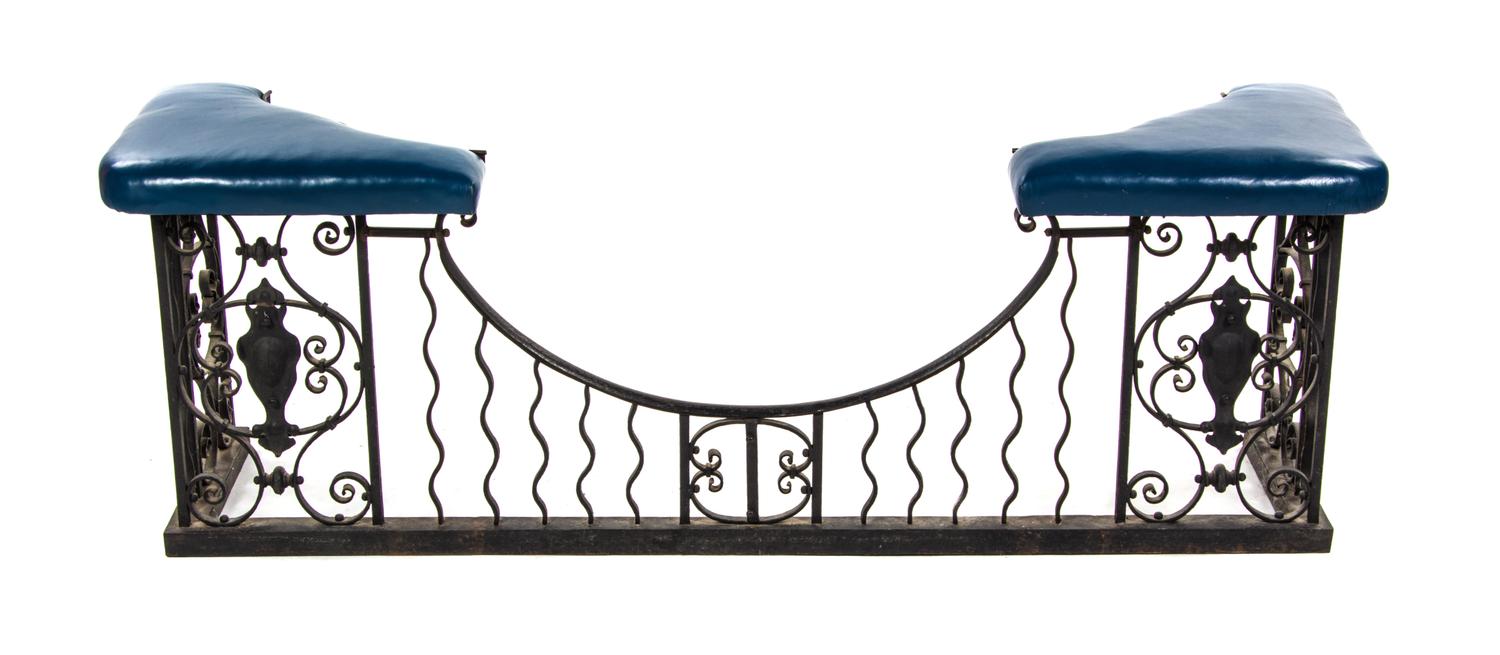 An Iron and Leather Club Fender, Height 24 x width 68 inches.