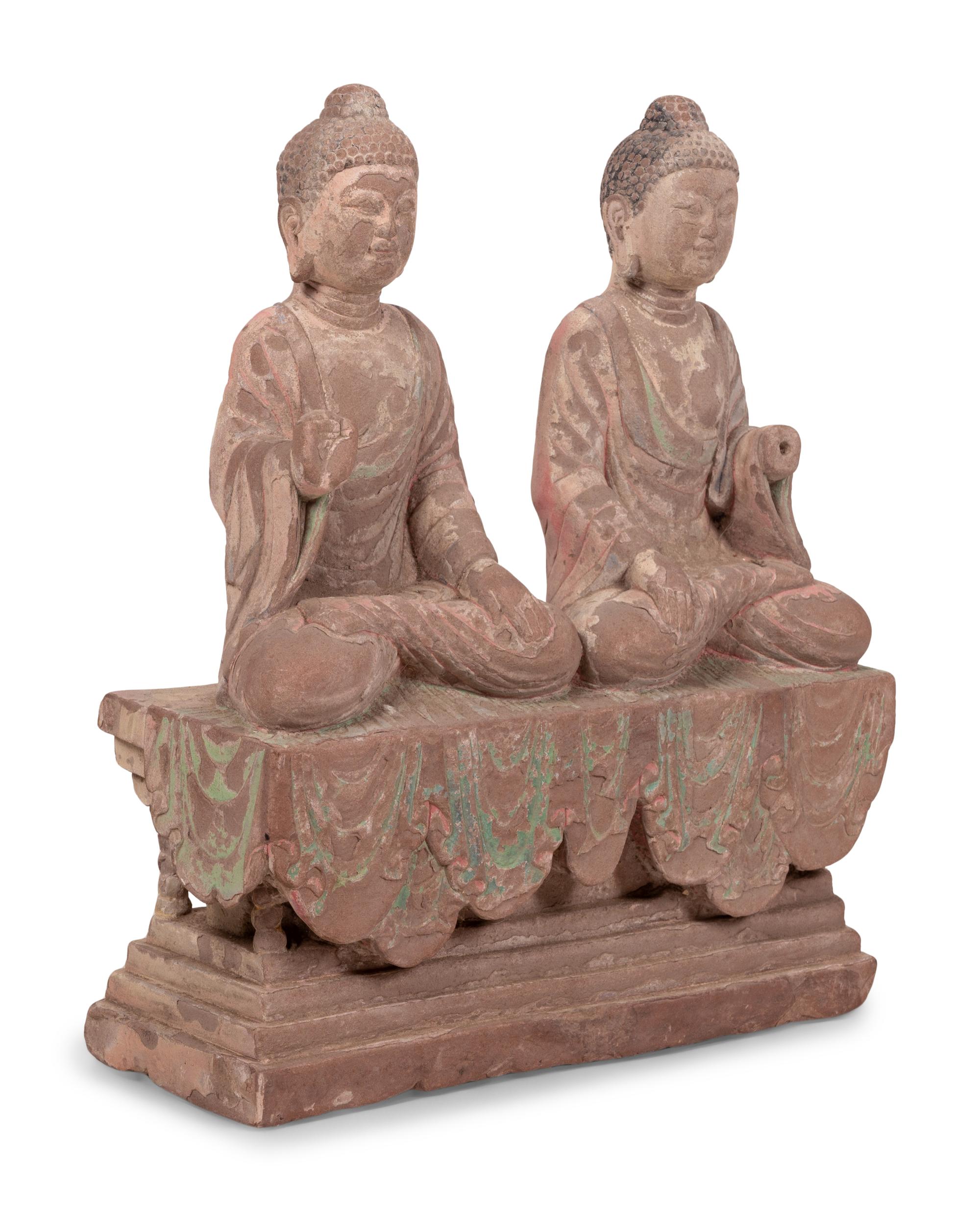 Two Chinese Carved Stone Seated Figures on a Rectangular Base with Remnants of Polychrome Decoration