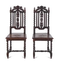 A Pair of Renaissance Revival Carved Oak Side Chairs