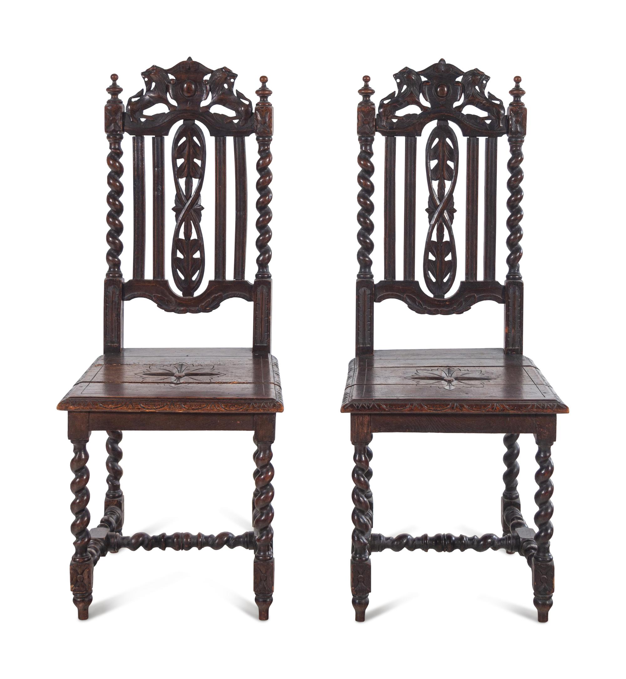 A Pair of Renaissance Revival Carved Oak Side Chairs