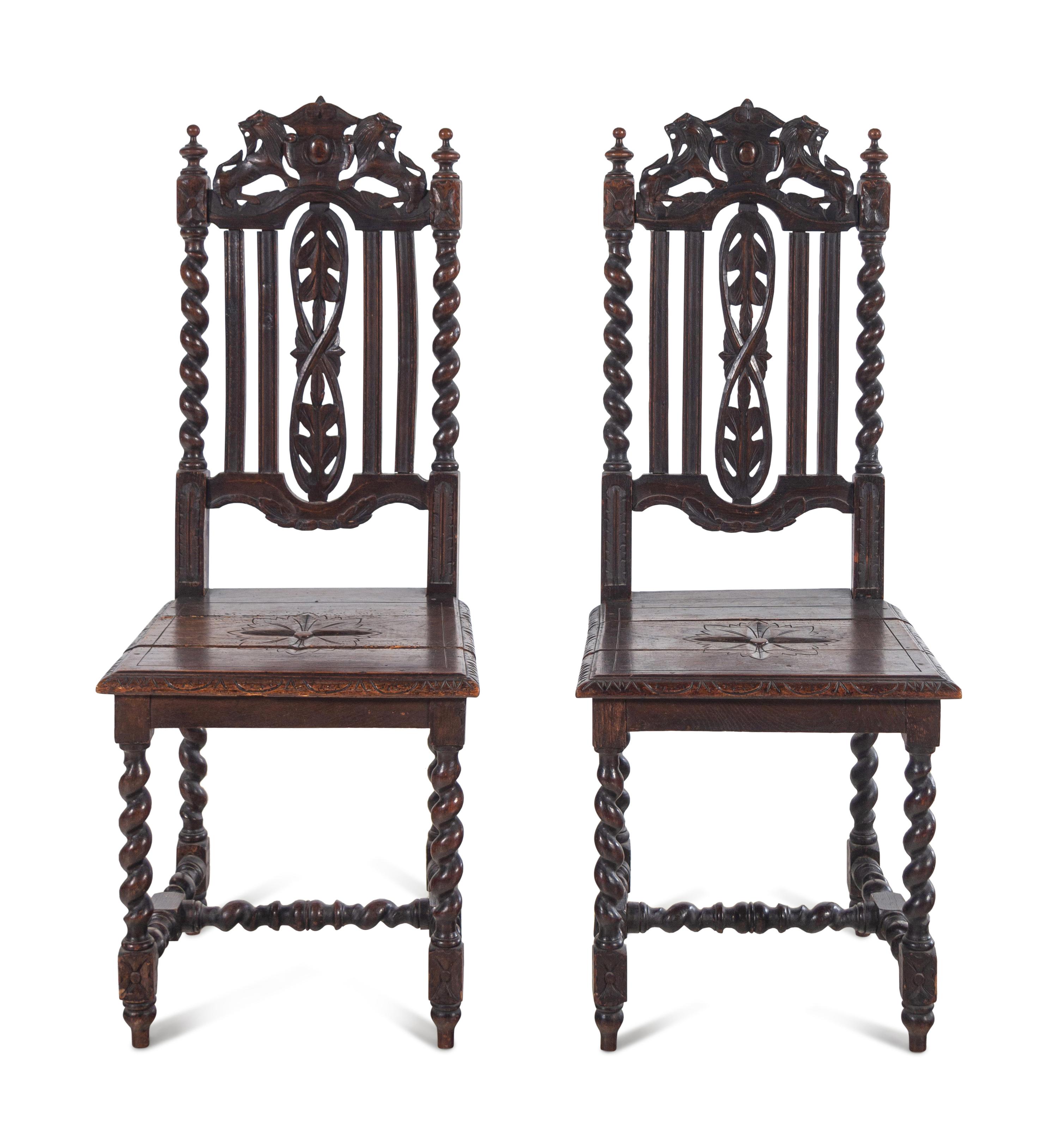 A Pair of Renaissance Revival Carved Oak Side Chairs