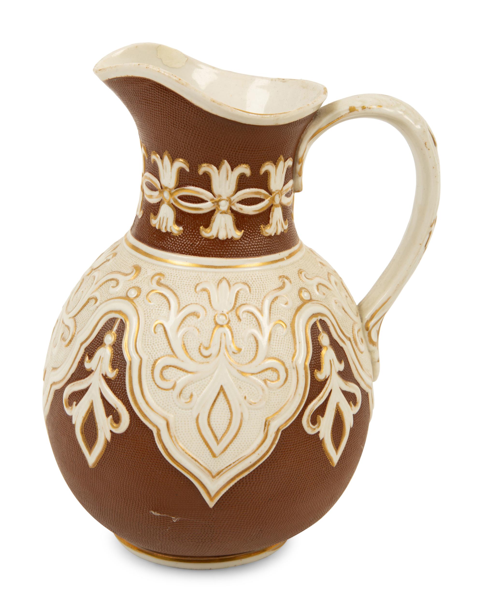 A Collection of Eight English Salt Glazed Relief Form Pitchers and Molded Earthenware — 19TH CENTURY