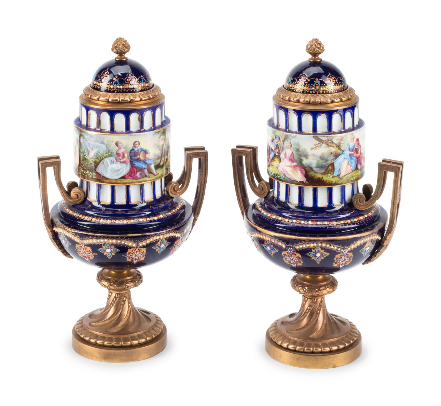 A Pair of Gilt Bronze Mounted Sèvres Style Porcelain Urns