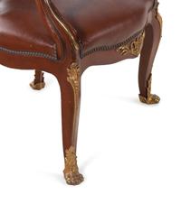 A Set of Fourteen Louis XV Style Gilt Bronze Mounted Walnut Dining Chairs