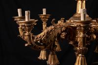 An Italian Rococo Style Giltwood Sixteen-Light Chandelier