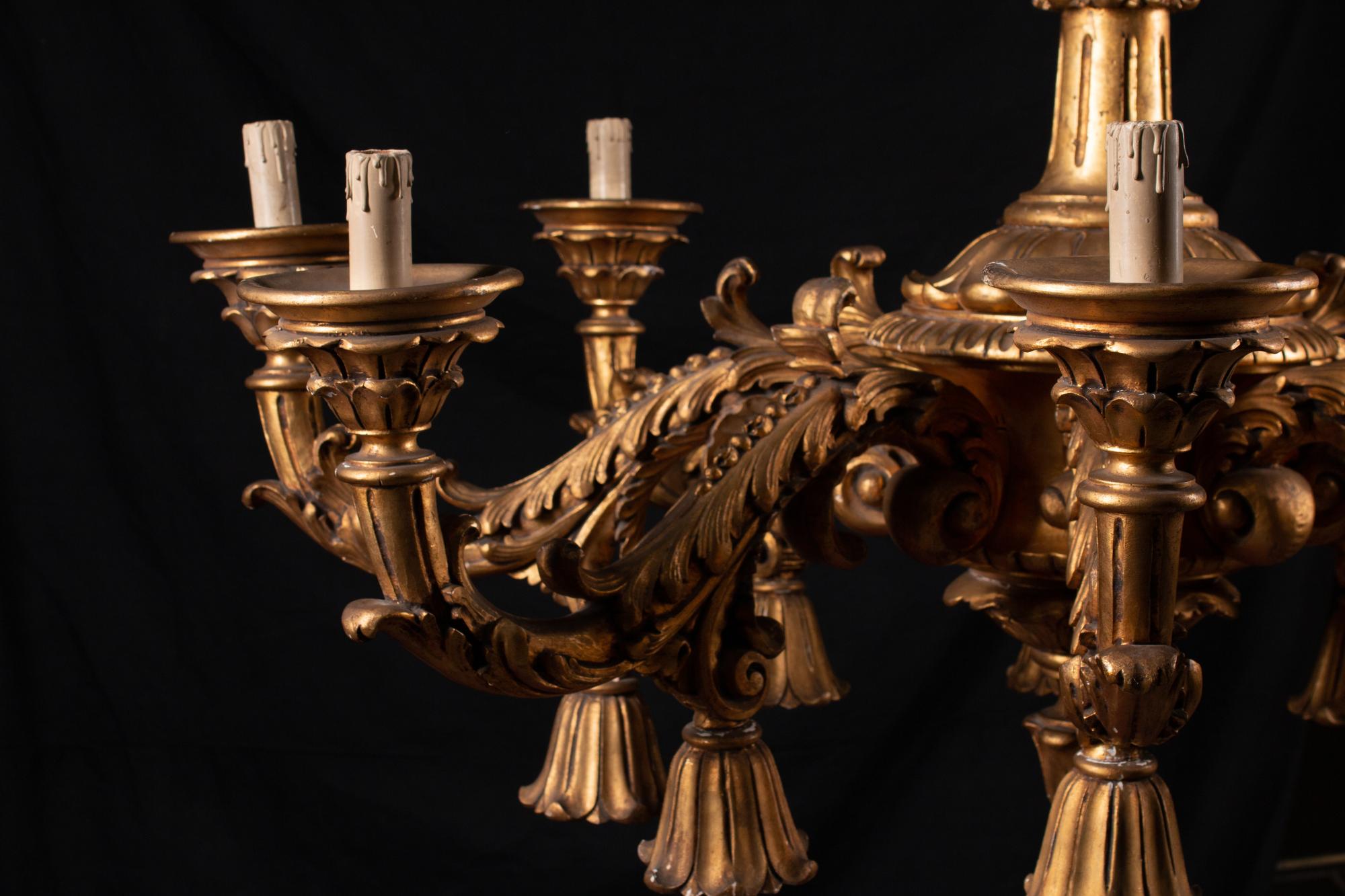 An Italian Rococo Style Giltwood Sixteen-Light Chandelier