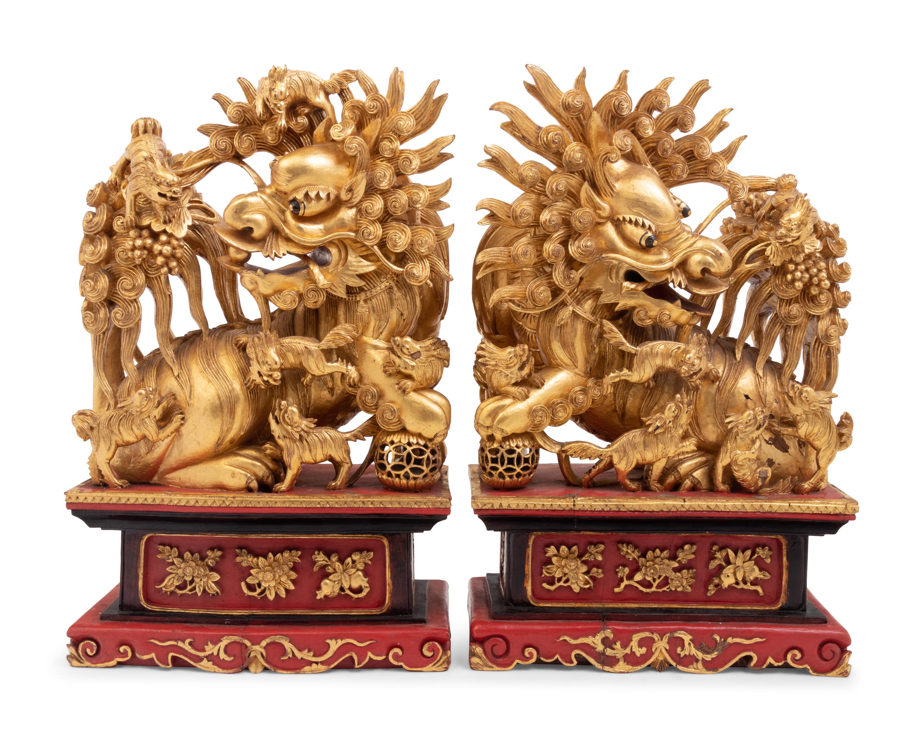 A Pair of Chinese Carved Giltwood Ornaments