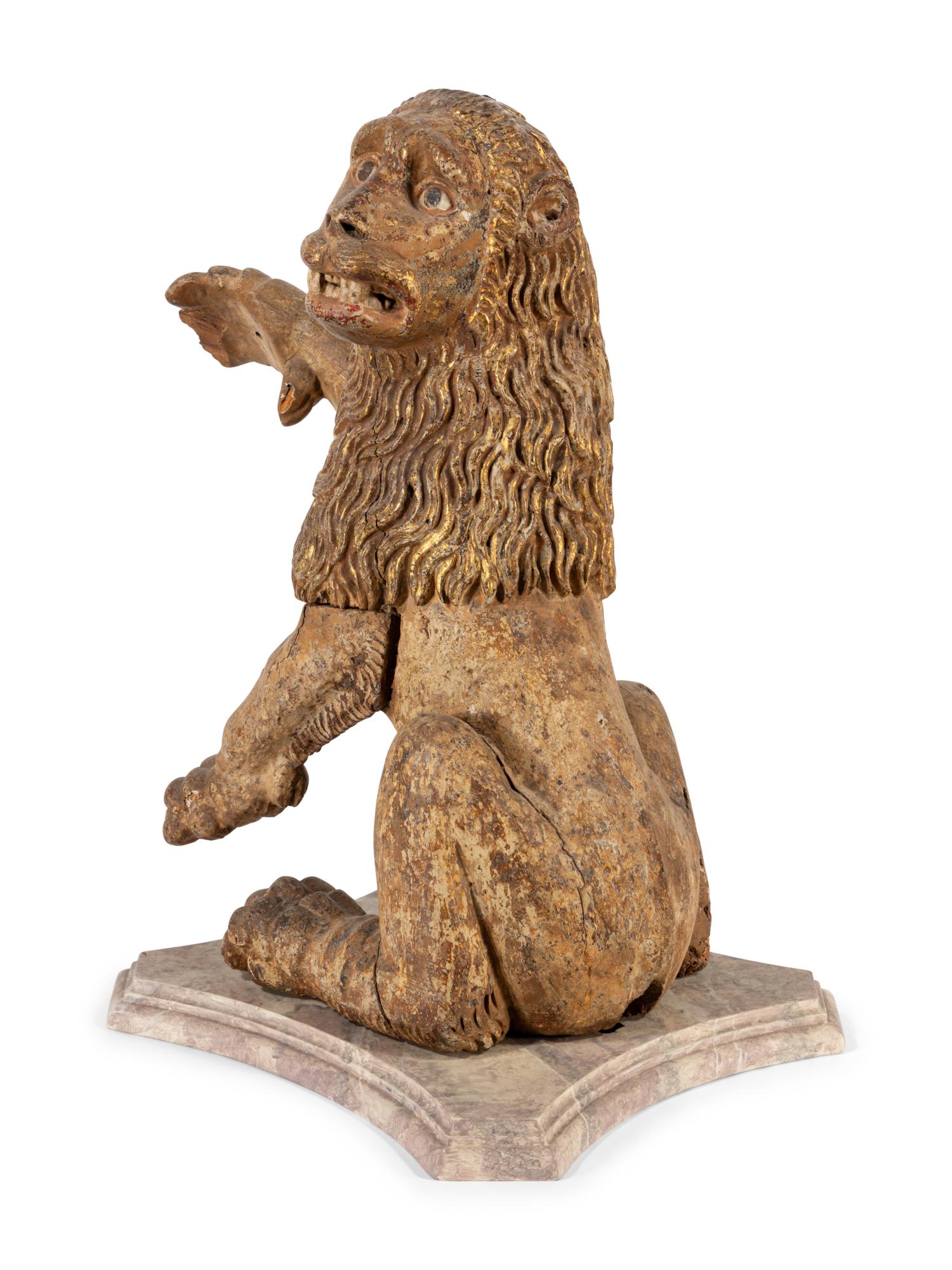 A Spanish Carved Wood and Polychrome Decorated Rampant Lion
