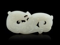 A White Jade Openwork Chilong Pendant — 18TH CENTURY