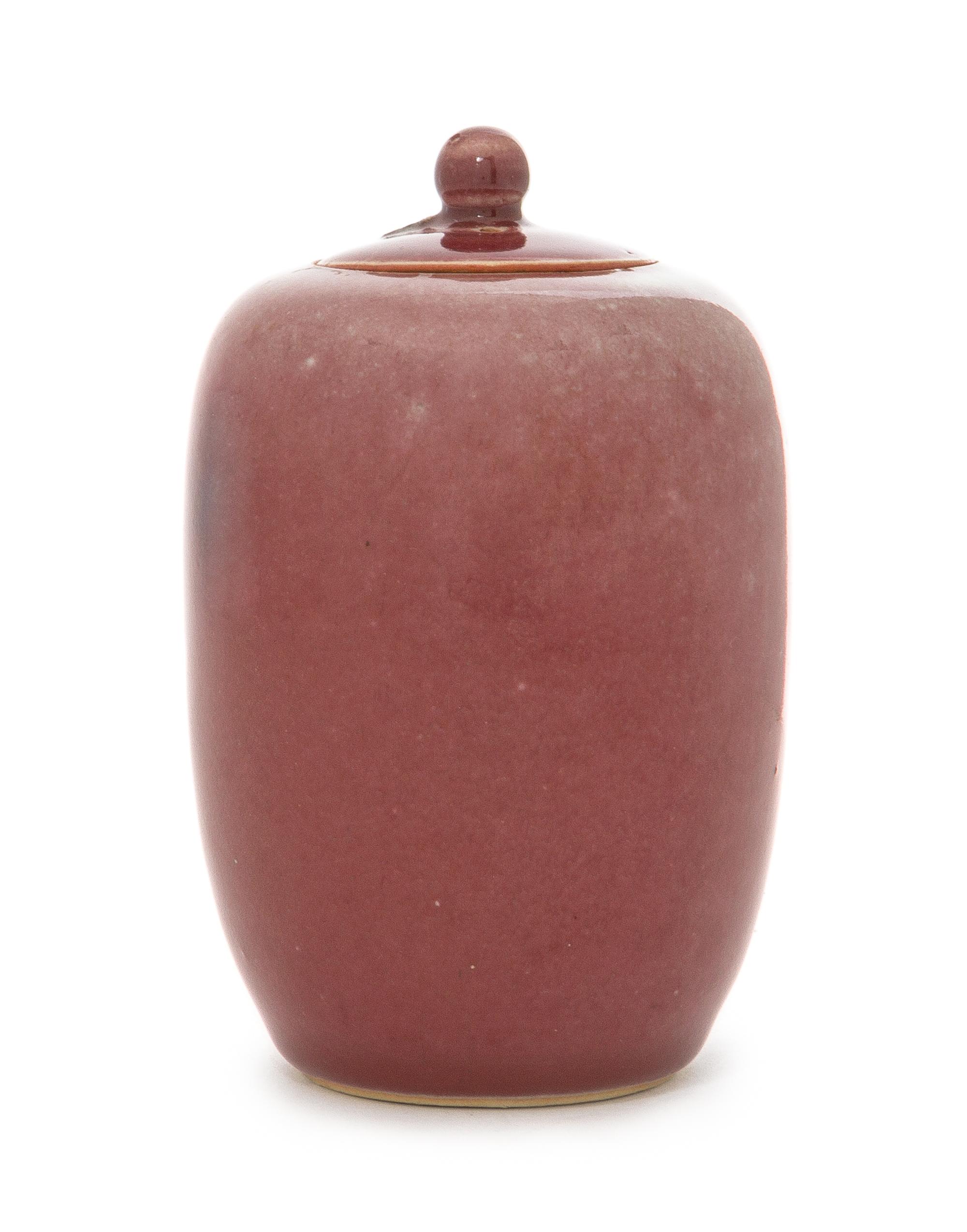 A Small Peachbloom Glazed Porcelain Covered Jar Height 4 7/8 inches.
