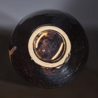 A Chinese Cizhou Black Glazed Globular Jar, Jin/Yuan Dynasty — 金/元 磁州窯黑釉鐵鏽花嘟噜瓶