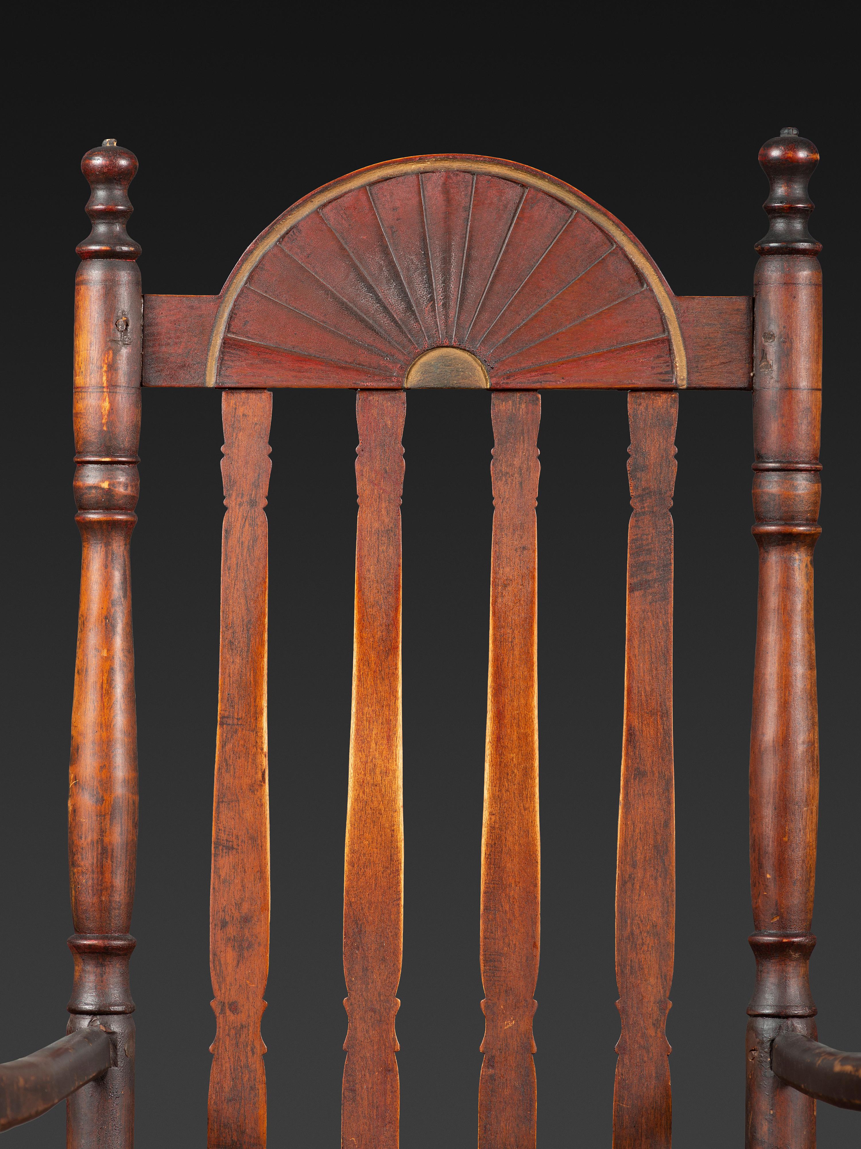 A William and Mary Style Parcel Gilt and Red Painted, Fan-Carved Bannister Back Woven Splint Seat Armchair