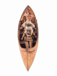 [ROOSEVELT, Theodore (1858-1919)]. Folk art canoe and figures representing Theodore Roosevelt's exploration of the River of Doubt during his expedition to Brazil in 1913-1914.