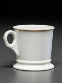 A Porcelain Shaving Mug Depicting a Woman Riding an Ice Velocipede