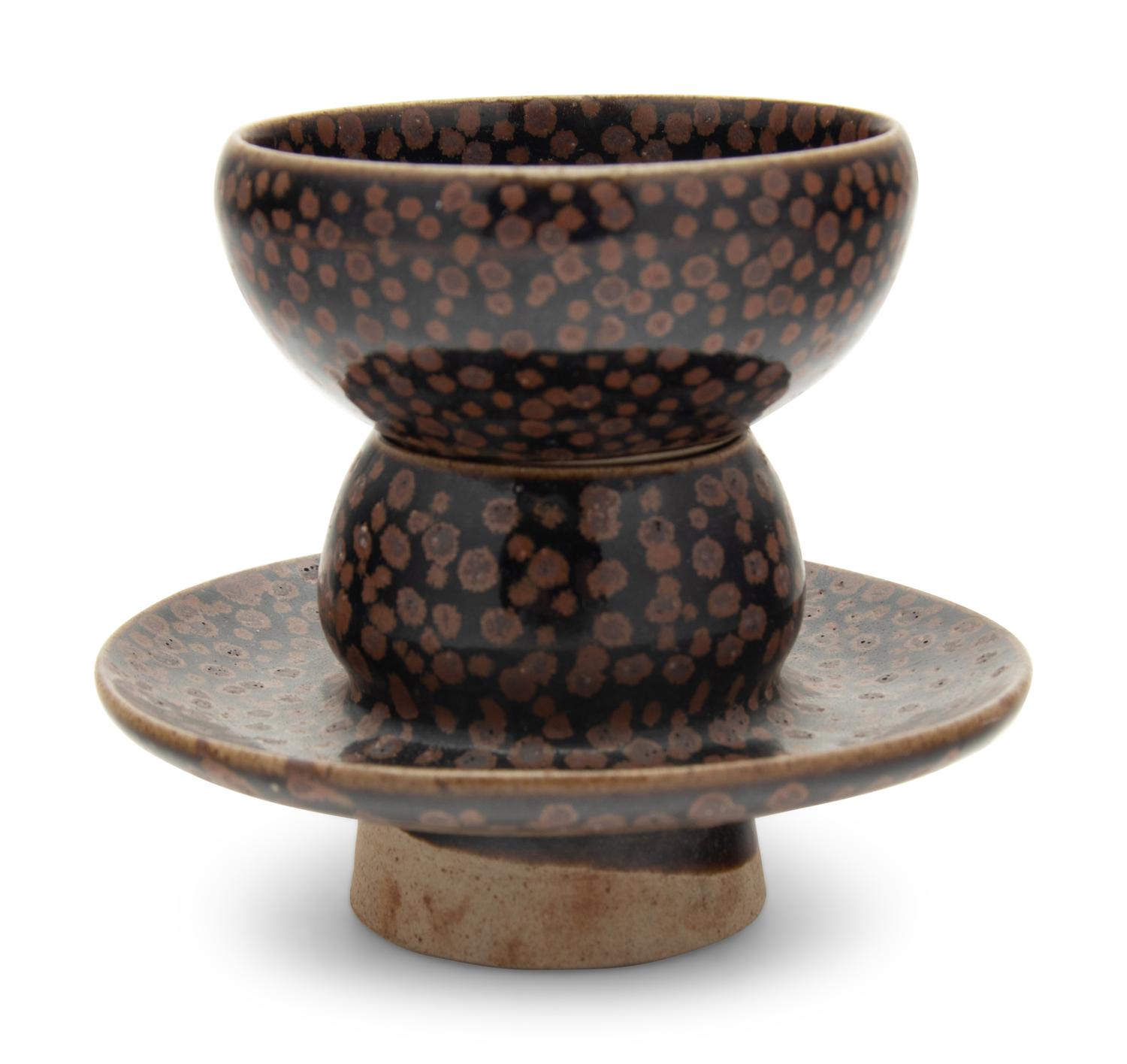 A Chinese Brown Splashed and Black Glazed Stoneware Teacup and Stand