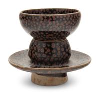 A Chinese Brown Splashed and Black Glazed Stoneware Teacup and Stand