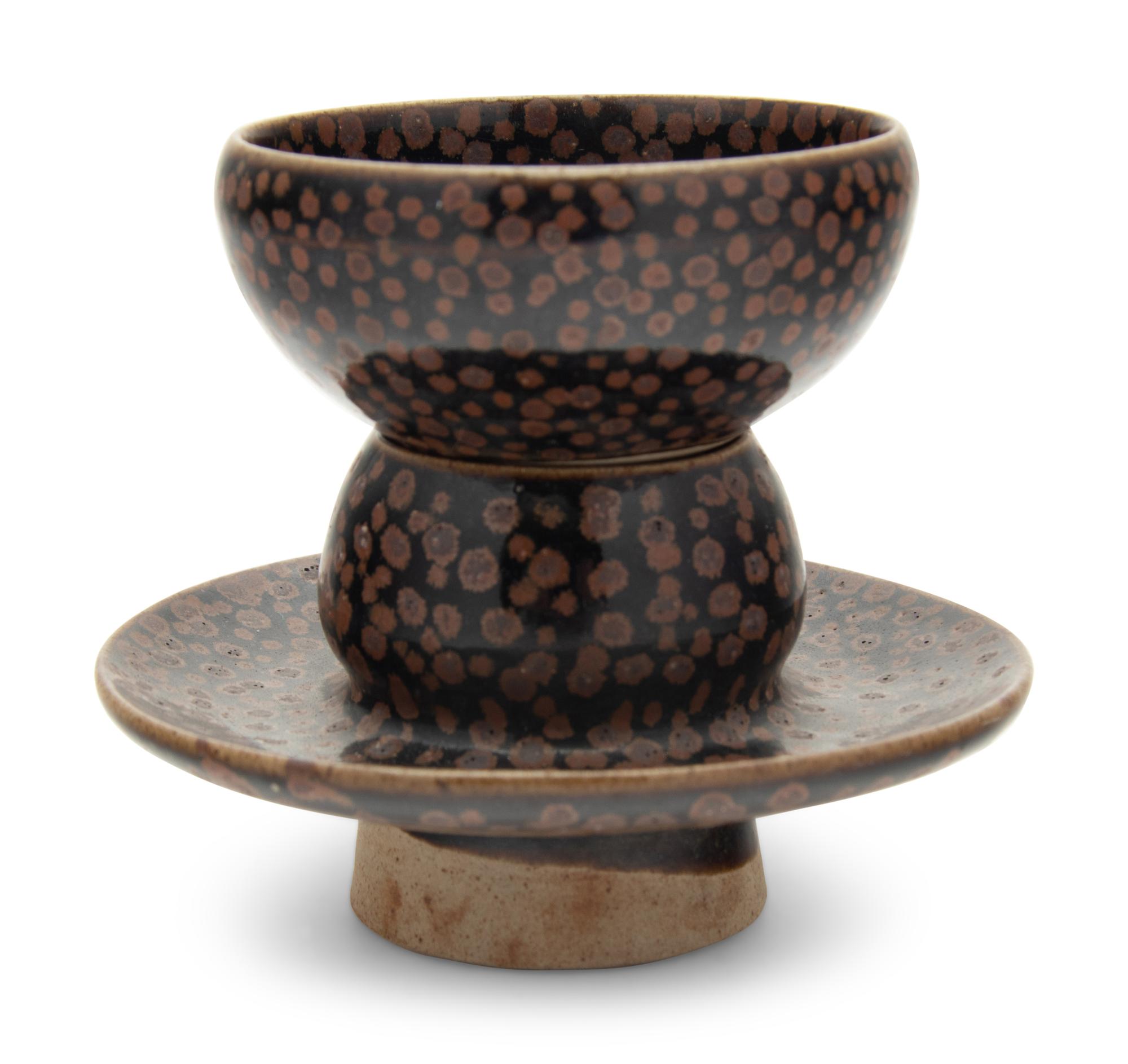 A Chinese Brown Splashed and Black Glazed Stoneware Teacup and Stand