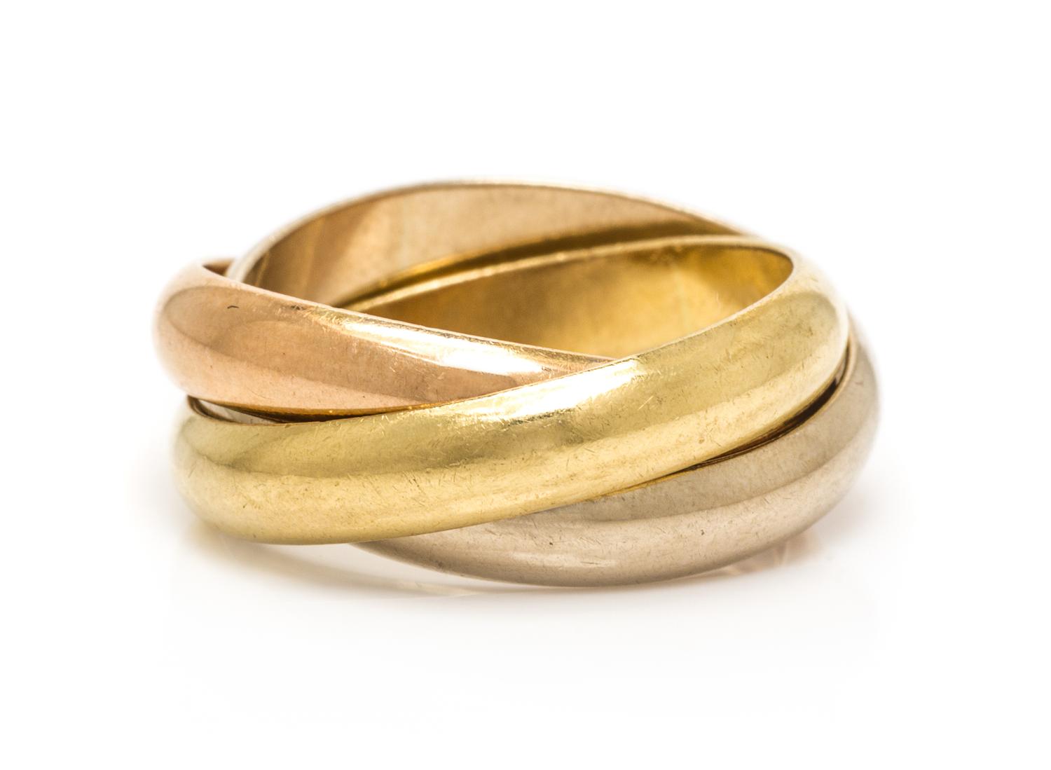An 18 Karat Tricolor Trinity Band, Cartier, 7.60 dwts.