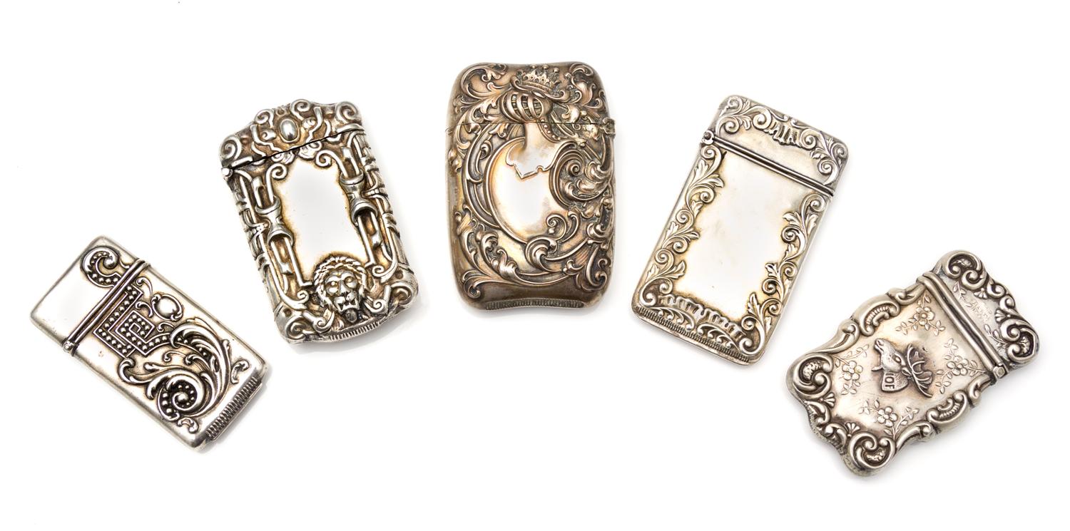 A Collection of Five American Silver Vesta Cases, Various Makers, comprising an example with a beaded meander and foliate decorated cas