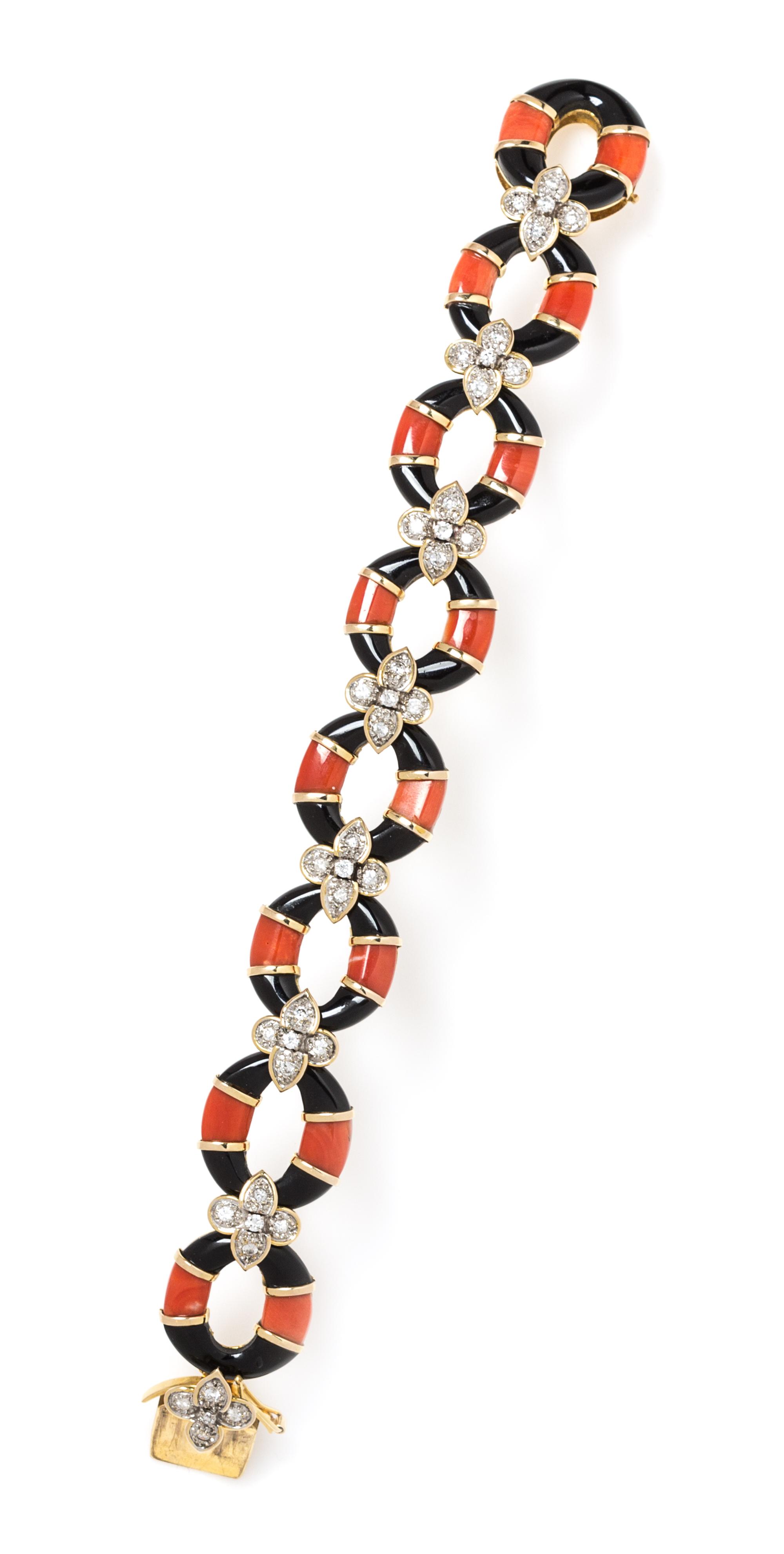 An 18 Karat Gold, Diamond, Onyx and Coral Bracelet, 33.40 dwts.