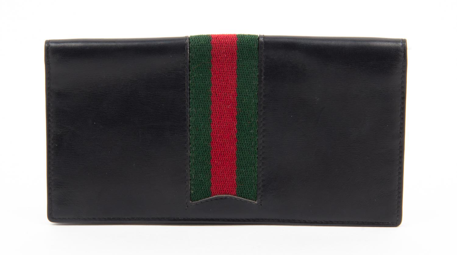 A Gucci Black Checkbook Cover, 6.25" x 3.25".