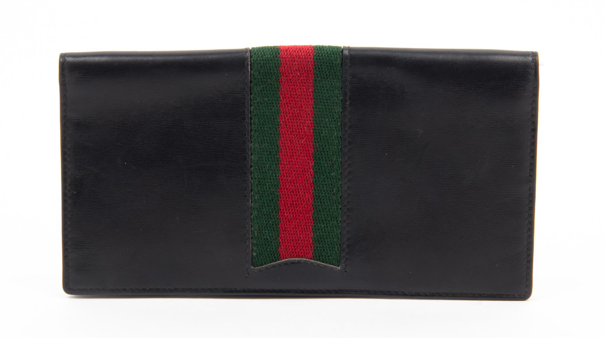 A Gucci Black Checkbook Cover, 6.25" x 3.25".