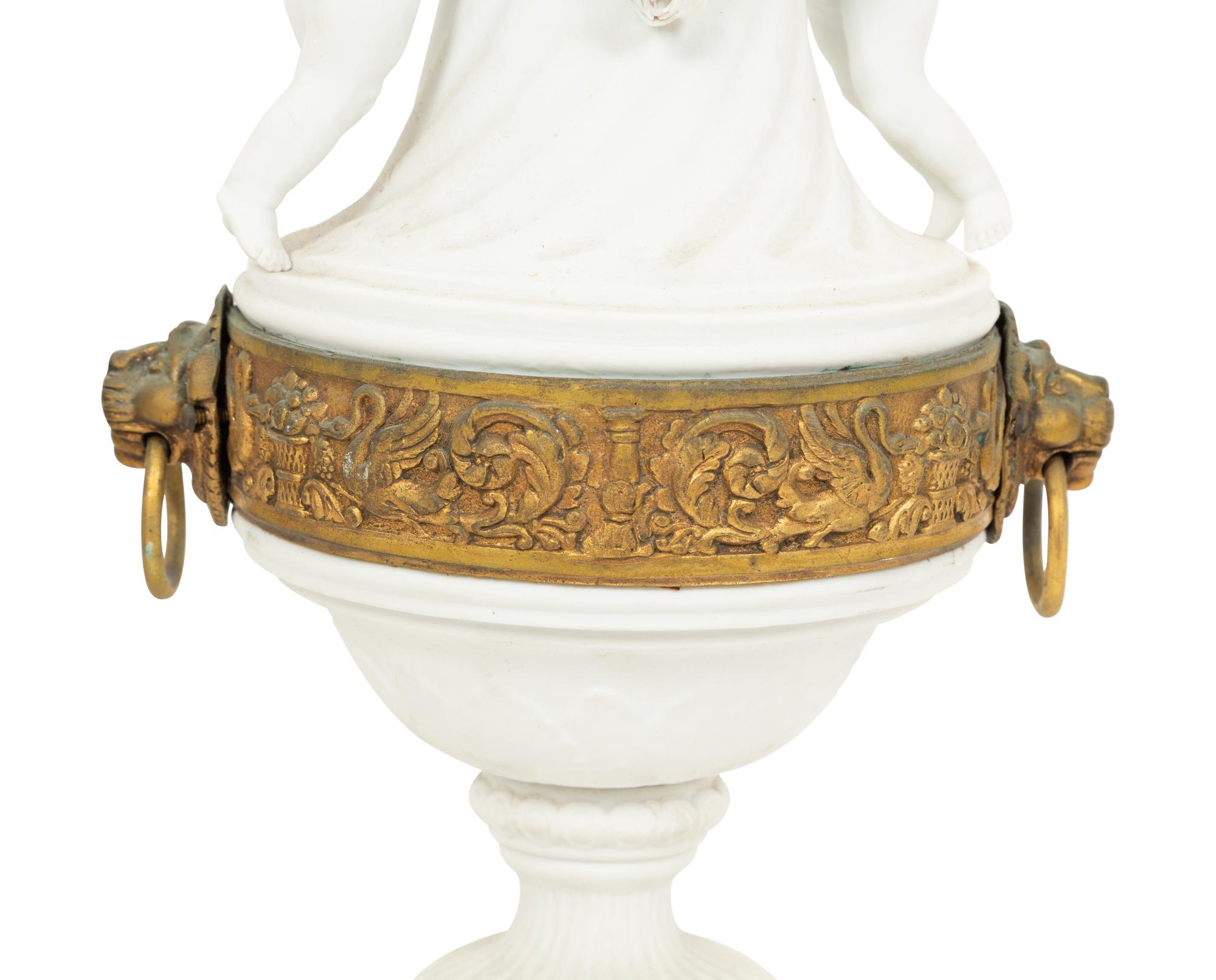 A Pair of Gilt Metal Mounted Bisque Porcelain Urns