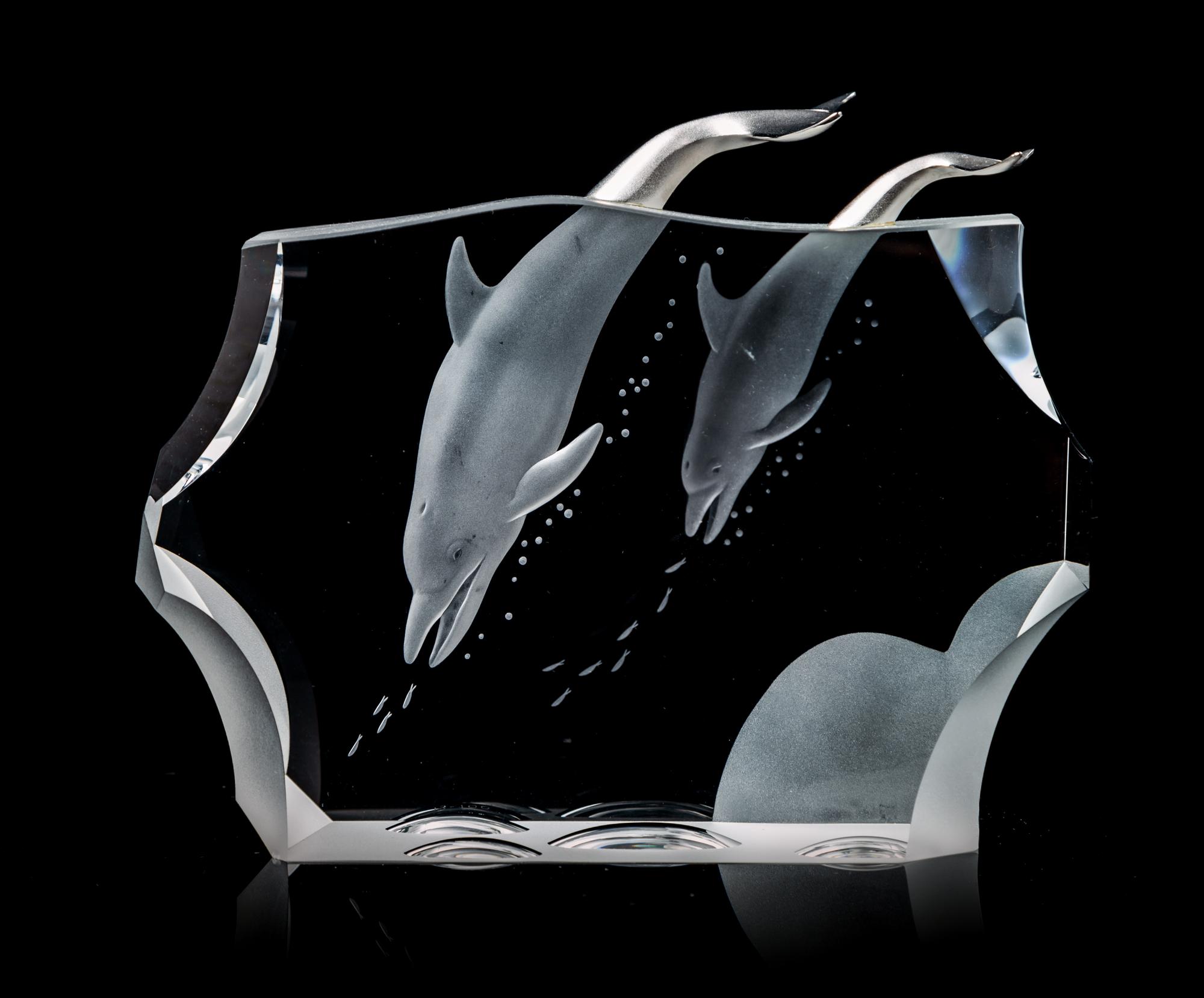 A Steuben Dolphin Group Length 7 1/4 inches.