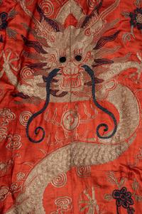 A Chinese Orange Ground Embroidered Silk Theatrical Dragon Robe