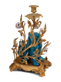 A Pair of French Gilt Bronze Mounted Turquoise Glazed Porcelain Guardian Lion Candelabra