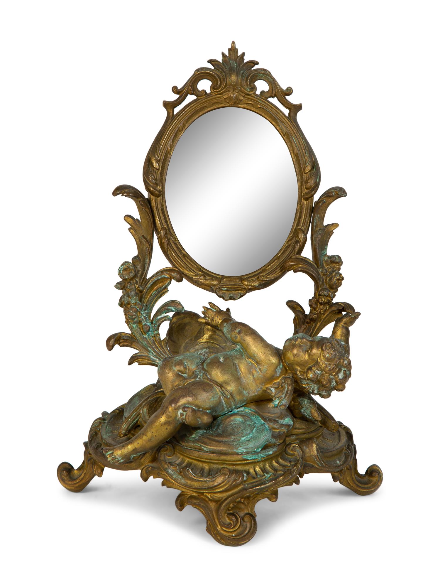 A Continental Rococo Style Gilt Metal Table Mirror
