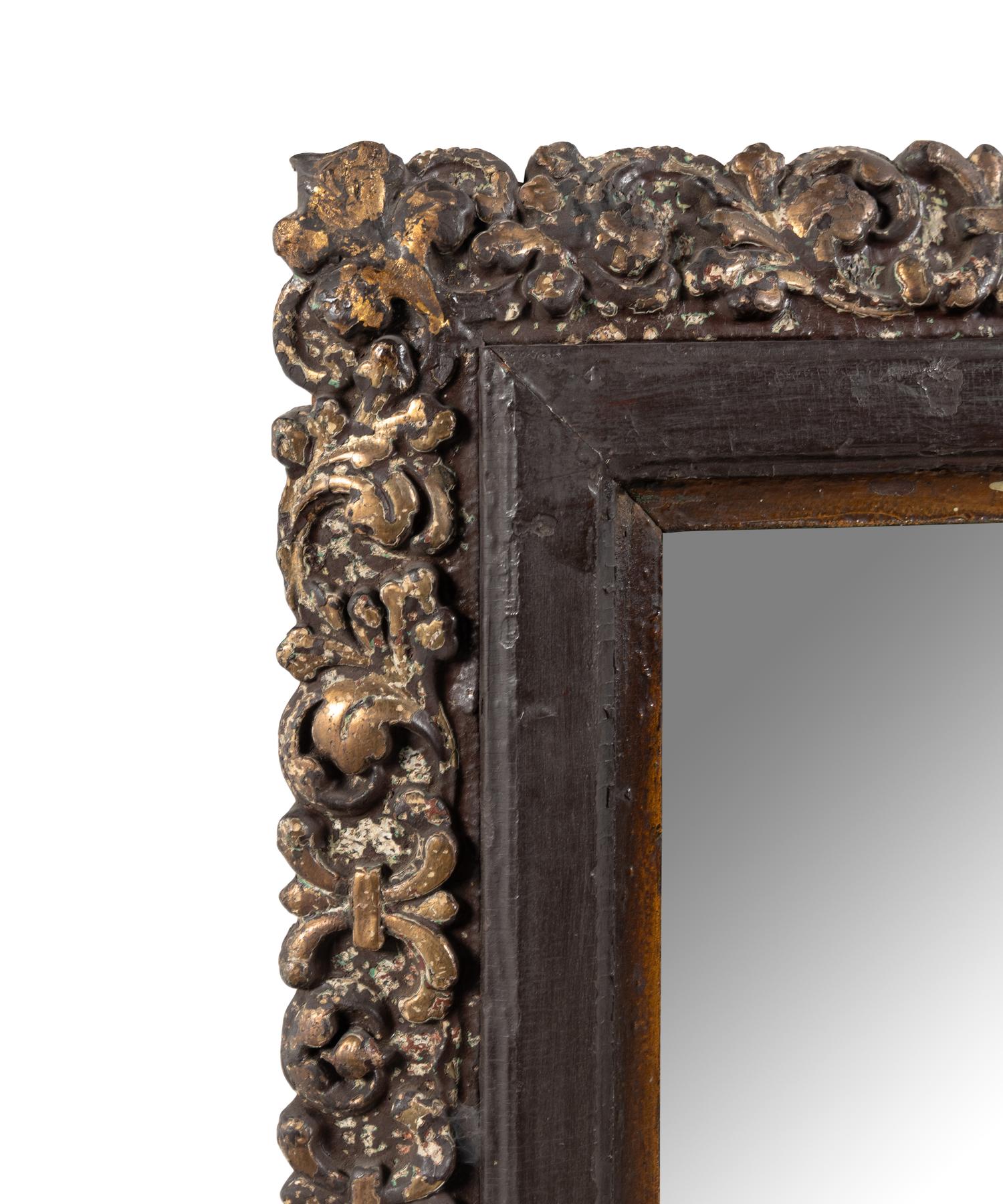 A Continental Polychrome and Parcel-Gilt Carved Mirror
