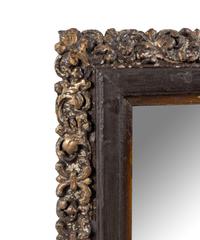 A Continental Polychrome and Parcel-Gilt Carved Mirror