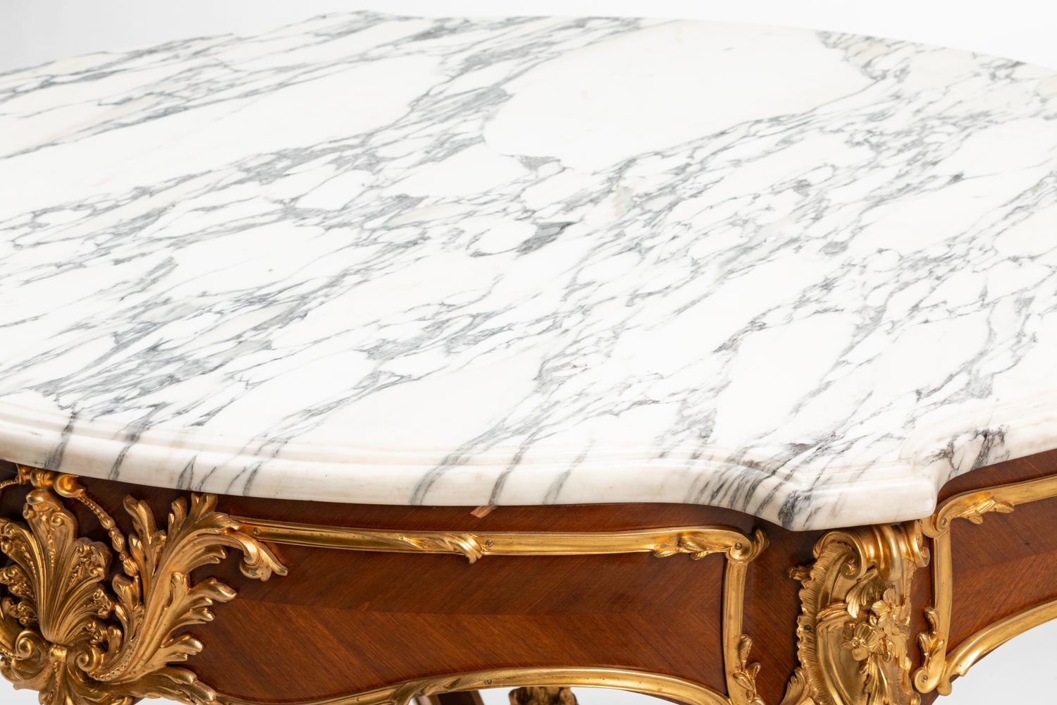 A Louis XV Style Gilt Bronze Mounted Marble-Top Center Table