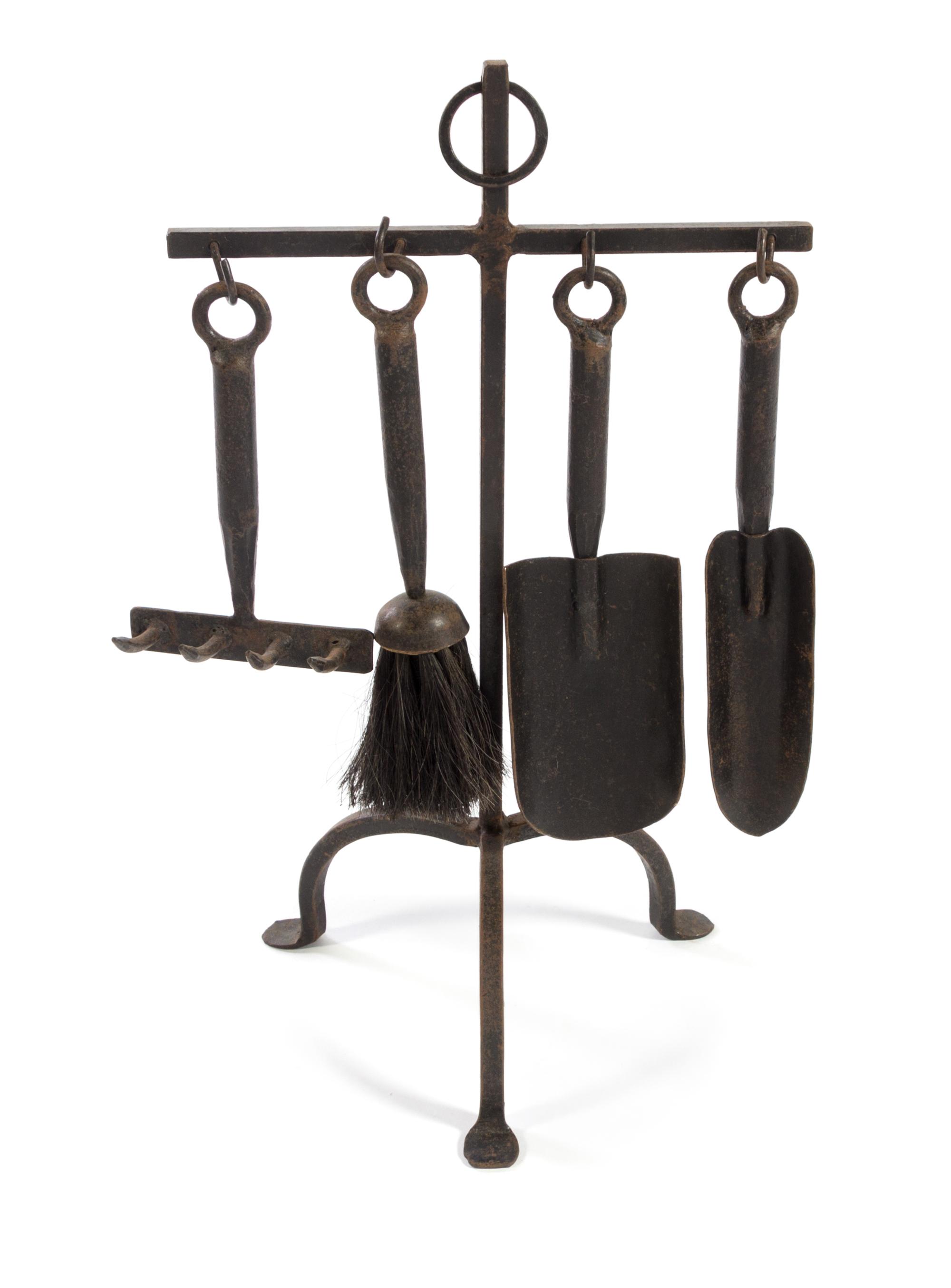 A Set of Wrought Iron Fire Tools Height of stand 20 inches.