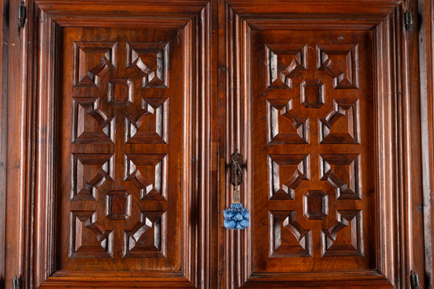 A Continental Walnut Two-Part Cabinet