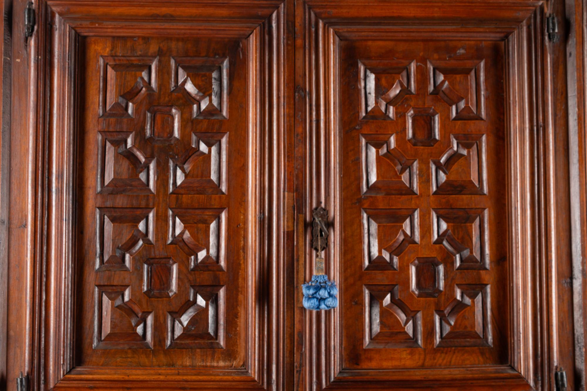 A Continental Walnut Two-Part Cabinet
