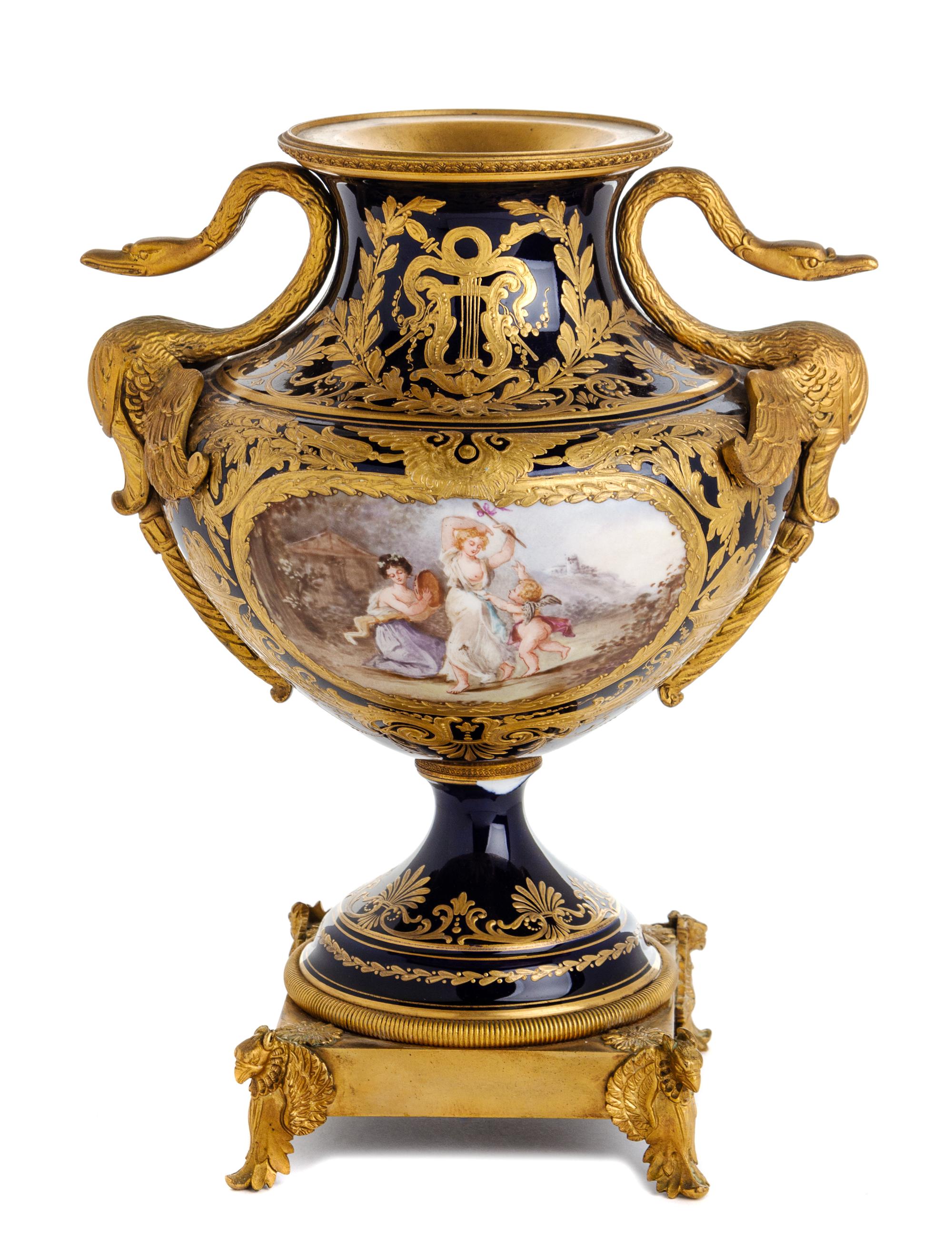 A Sevres Style Gilt Bronze Mounted Porcelain Urn Height 12 3/8 inches. — 19TH CENTURY