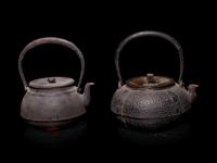 Seven Japanese Cast Iron Teapots, Tetsubin, and Burner