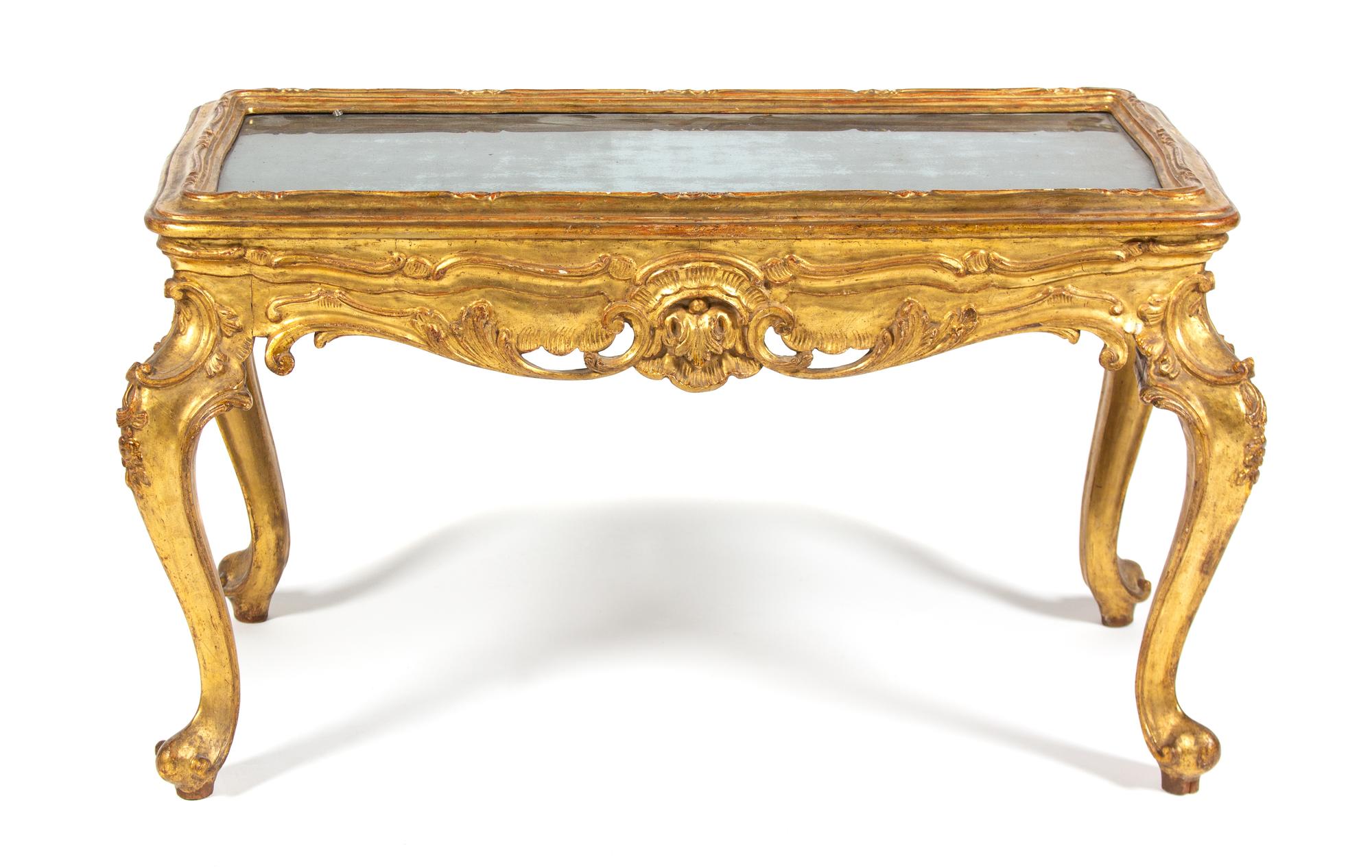 An Italian Rococo Style Giltwood Table with Mercury Glass Inset Top Height 20 x width 35 x depth 18 inches. — 19TH CENTURY