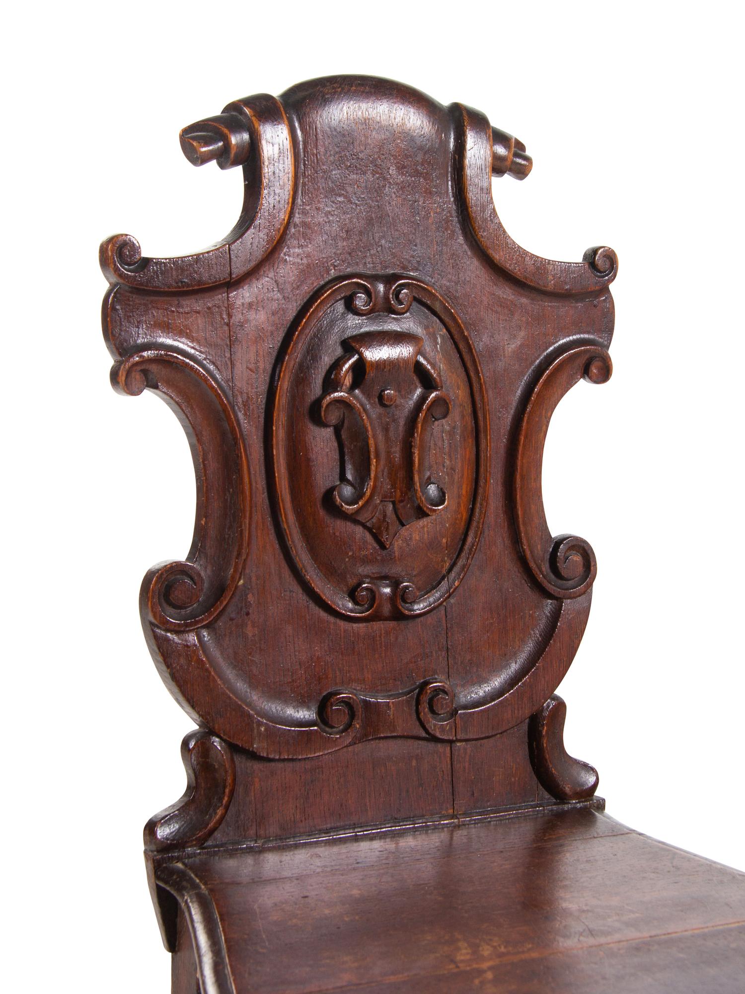 A Pair of Regency Style Oak Hall Chairs
