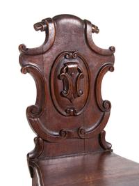 A Pair of Regency Style Oak Hall Chairs