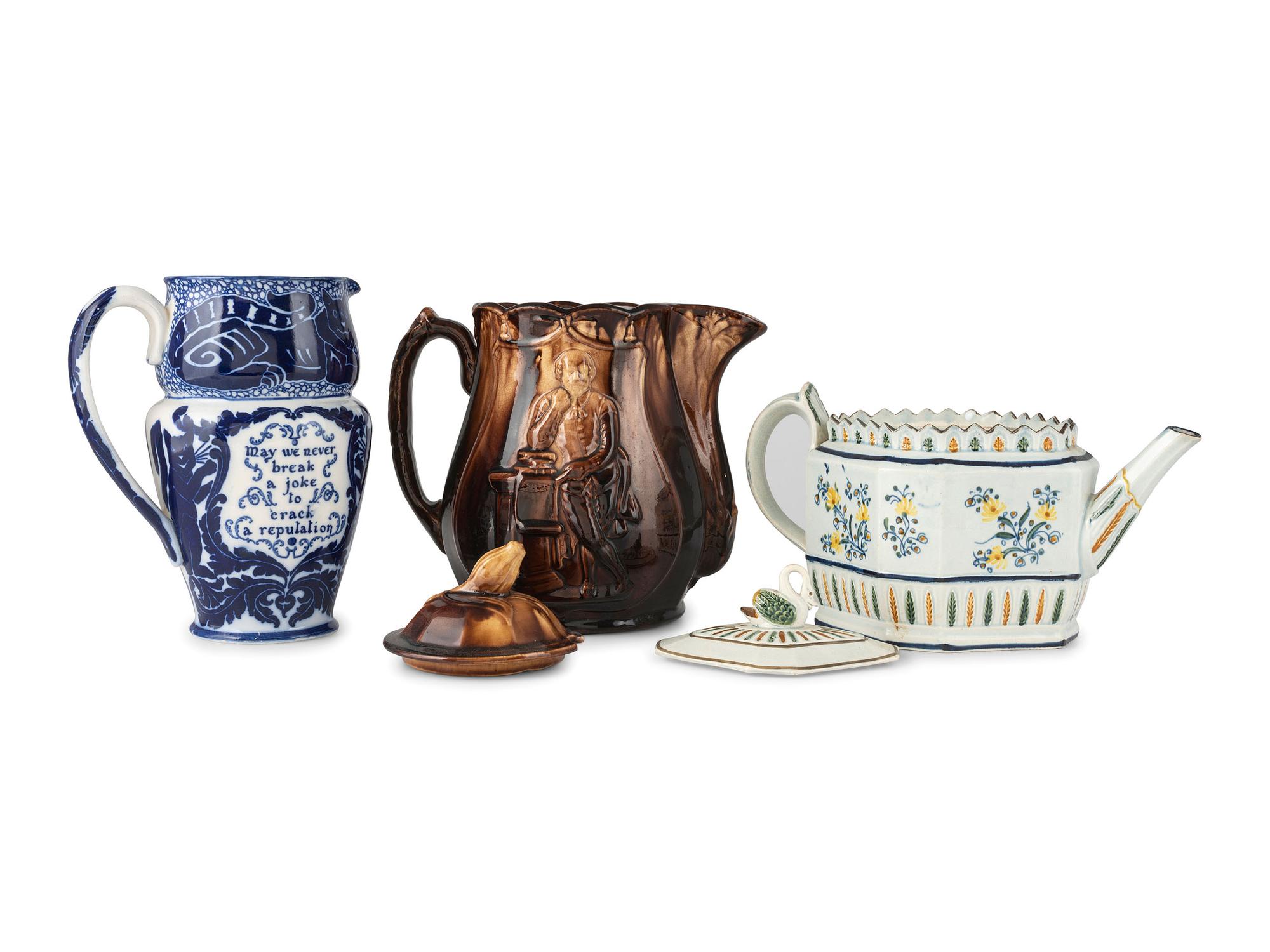 A Creamware Teapot, Rockingham Pitcher, and Royal Doulton Pitcher
