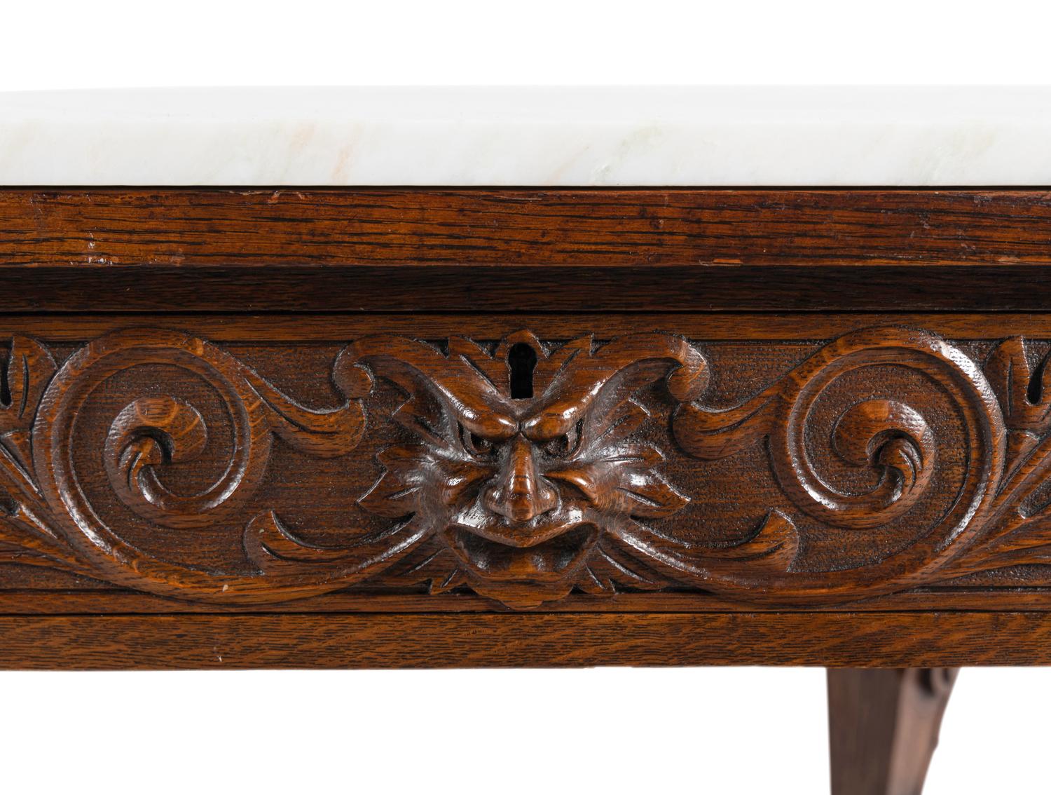 A Renaissance Style Carved Oak Marble-Top Low Table